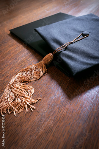 Mortarboard graduation cap and tassle and diploma photo