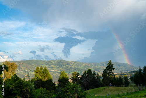 beautiful rainbow in a lush green nature landscape in south america