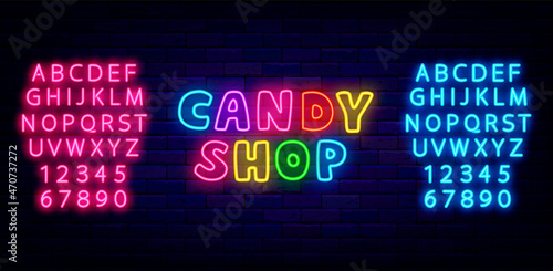 Candy shop colorful neon text. Sweet bar label with alphabet. Logo on brick wall. Isolated vector illustration