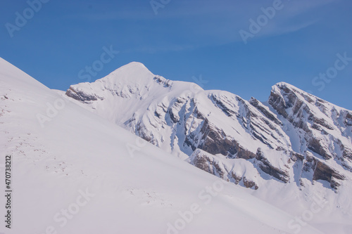 Beautiful panoramic view of snow-capped mountains in the Swiss Alps.