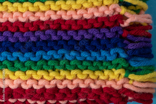 hand knitting background featuring rainbow coloured super chunky yarn  © MW Photography 