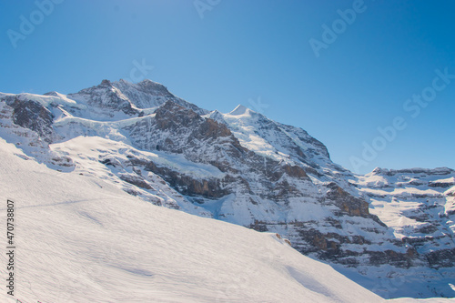 Beautiful panoramic view of snow-capped mountains in the Swiss Alps..