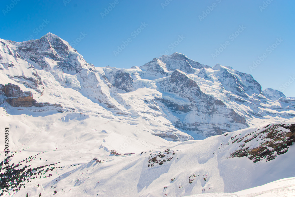 Beautiful panoramic view of snow-capped mountains in the Swiss Alps.
