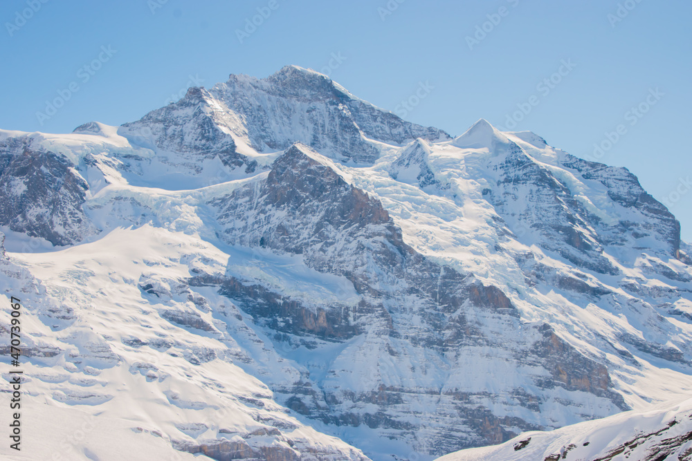 Beautiful panoramic view of snow-capped mountains in the Swiss Alps.
