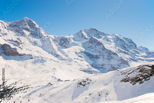 Beautiful panoramic view of snow-capped mountains in the Swiss Alps. 