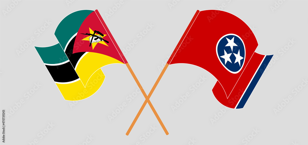 Crossed and waving flags of The State of Tennessee and Mozambique Crossed and waving flags of The State of Tennessee and Mozambique