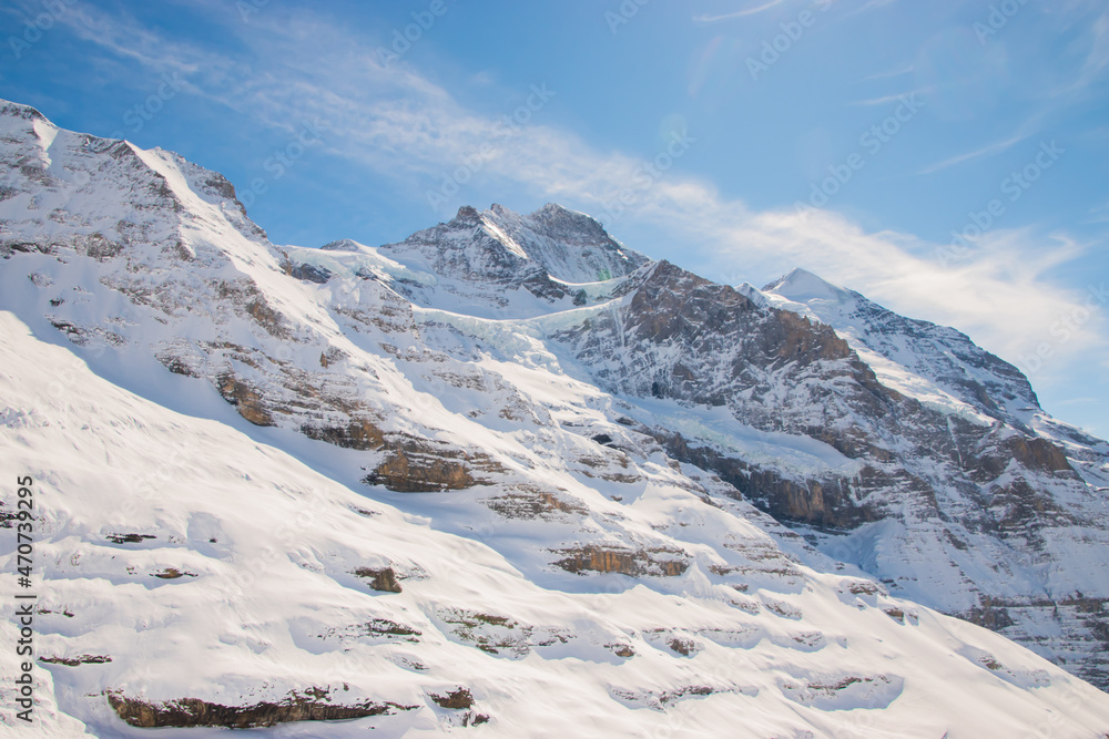 Beautiful panoramic view of snow-capped mountains in the Swiss Alps.