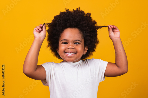 Konstfotografi cute afro girl with black power hair smiling at camera