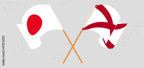 Crossed and waving flags of Japan and The State of Alabama