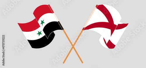 Crossed and waving flags of Syria and The State of Alabama