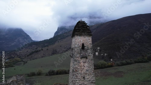 Close-up circle flyby ancient towers of Egikal complex by a drone. Republic of Ingushetia. Caucasus mountains, Russia photo