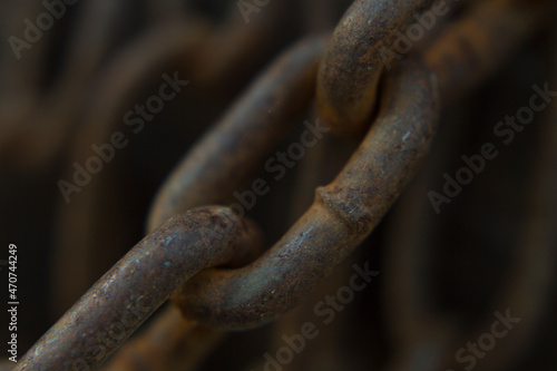 close up part of an old rusted steel chain 