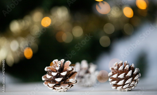 pine cones and Christmas lights holiday background