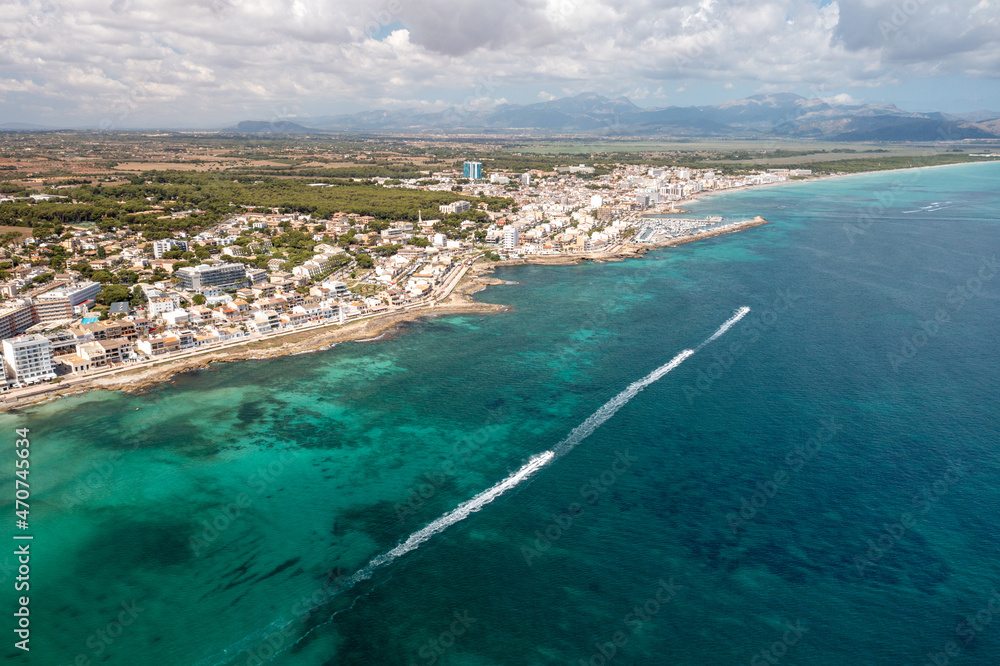 Aerial drone photo of the beach front on the Spanish island of Majorca Mallorca, Spain viewed from above on a bright sunny summers day showing the beach front in the village of Can Picafort Aerial drone photo of the beach front on the Spanish island of Majorca Mallorca, Spain viewed from above on a bright sunny summers day showing the beach front in the village of Can Picafort