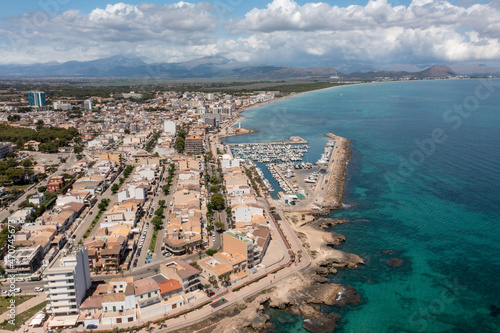 Obraz na płótnie Aerial drone photo of the beach front on the Spanish island of Majorca Mallorca, Spain viewed from above on a bright sunny summers day showing the beach front in the village of Can Picafort w salonie