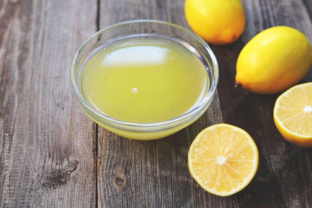 freshly squeezed lemon juice in a small bowl freshly squeezed lemon juice in a small bowl