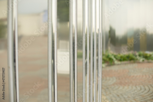 Mirror wall in the park. Architectural element to decorate the city. Reflective surface.