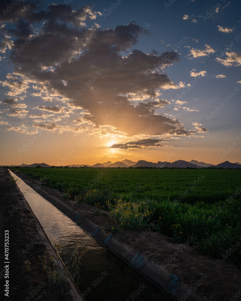 Agriculture water canal next to farmland in Tucson, Arizona. 