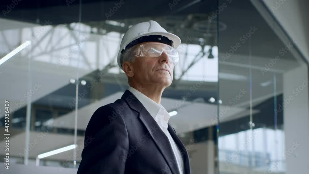 Successful Businessman Wearing Protective Glasses And Helmet In Office Center Successful Businessman Wearing Protective Glasses And Helmet In Office Center