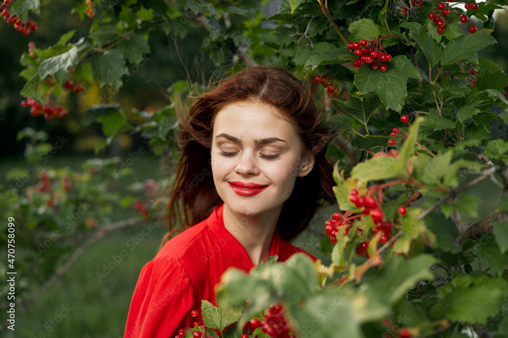 cheerful woman in a red shirt bush berries countryside cheerful woman in a red shirt bush berries countryside