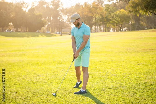 handsome man playing golf game on green grass, recreation