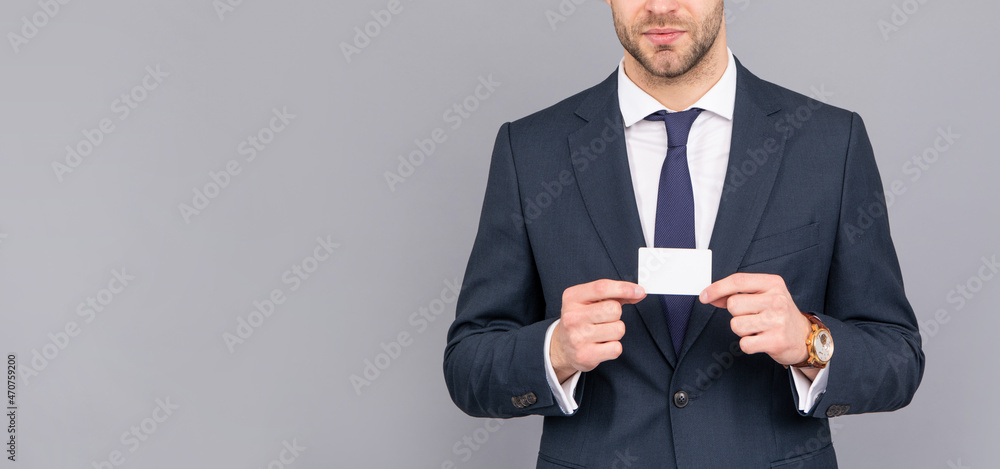 cropped businessman hold credit card with copy space on grey background, banking cropped businessman hold credit card with copy space on grey background, banking