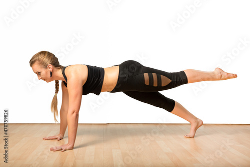 Fitness Woman Practicing Yoga in Studio