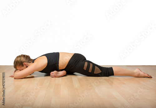Fitness Woman Practicing Yoga in Studio