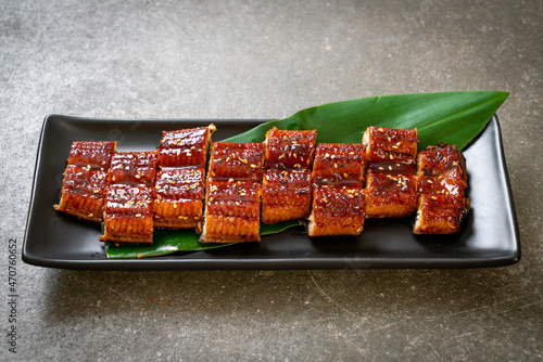 sliced grilled eel or grilled unagi with sauce photo