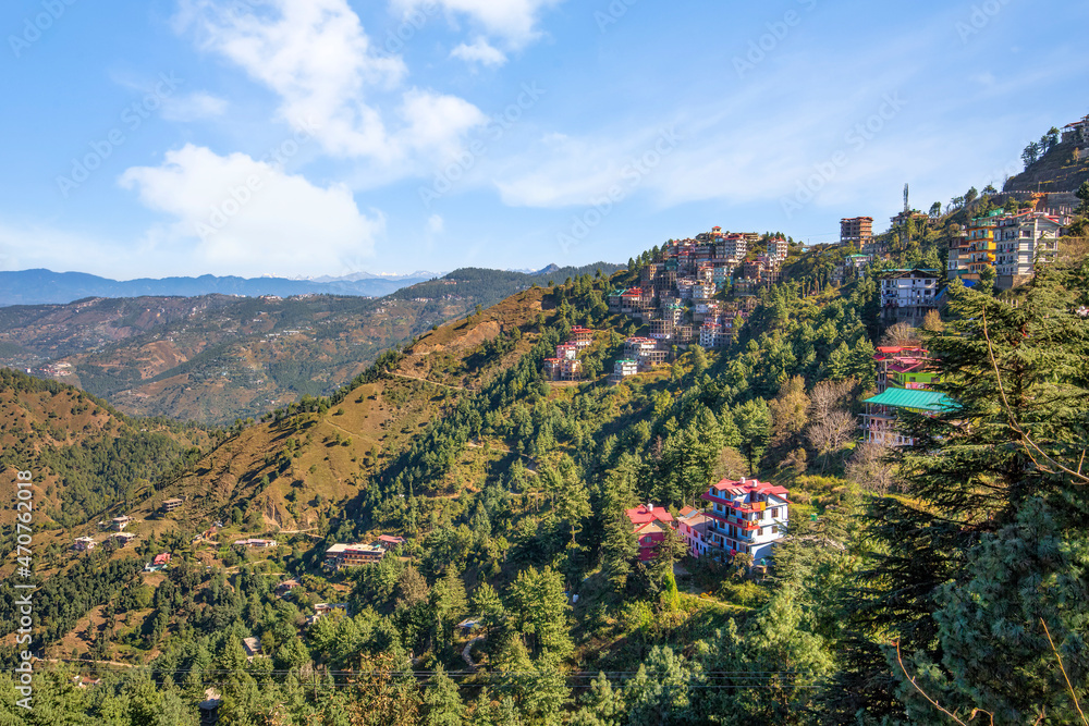 Scenic hill station aerial view with cityscape on the mountain slopes and Himalayan landscape at Himachal Pradesh, India Scenic hill station aerial view with cityscape on the mountain slopes and Himalayan landscape at Himachal Pradesh, India
