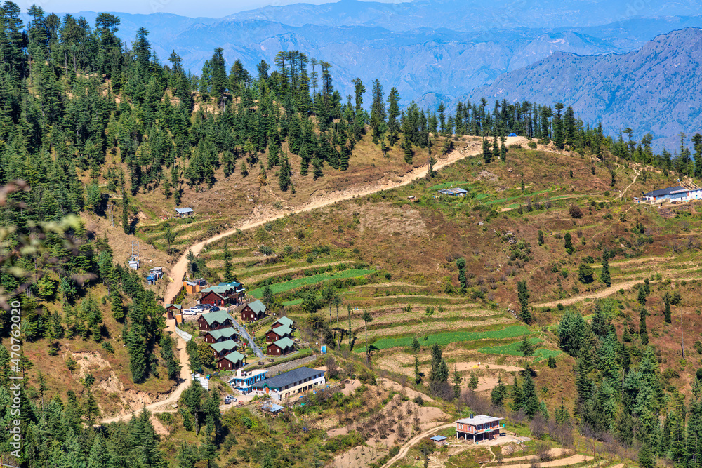 Scenic Himalaya landscape with tourist cottages on the mountain slopes at Sarahan Himachal Pradesh, India