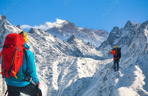 Male tourist hikers on Himalayan trek in the Kailash mountain at Kaza Himachal Pradesh, India