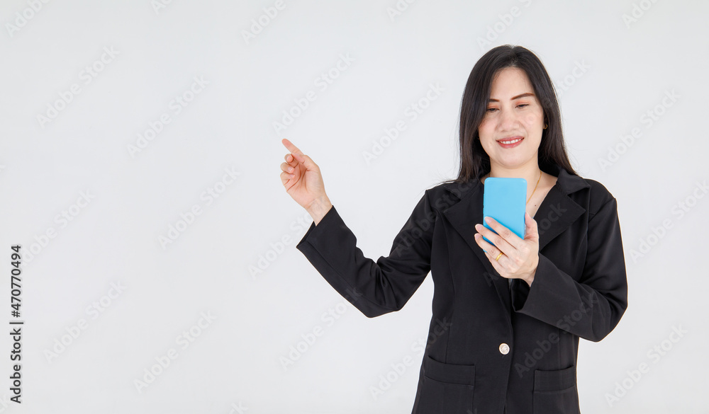 Elegant Asian businesswoman reading message with happy from mobile-phone and smile to point finger to explain amazing campaign promotion and interesting notice Elegant Asian businesswoman reading message with happy from mobile-phone and smile to point finger to explain amazing campaign promotion and interesting notice