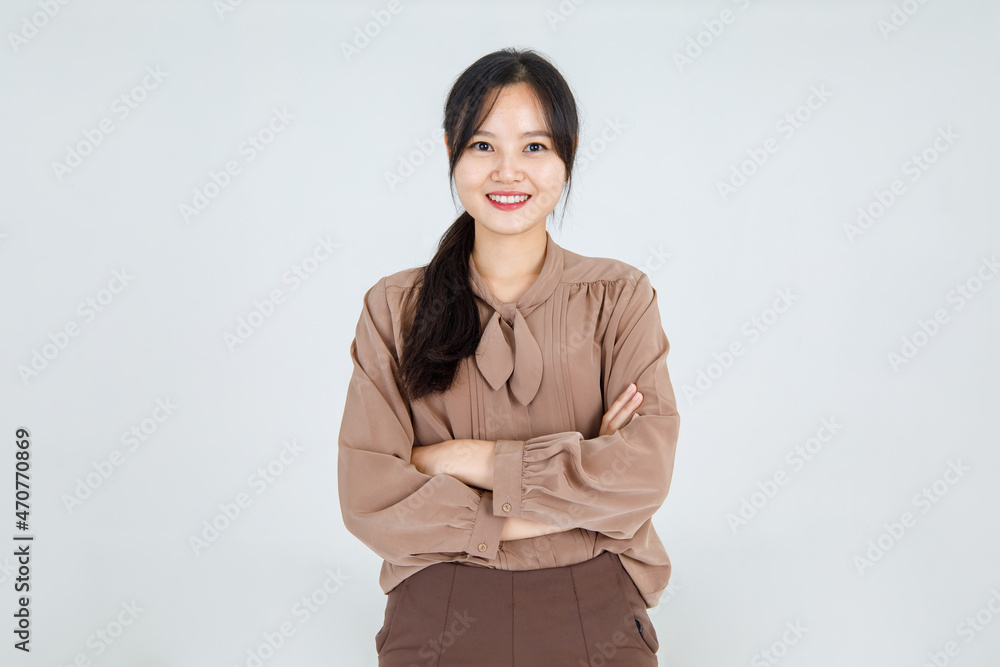 Lovely Asian girl cheerfully smile as friendly emotion and confident while standing with arm crossed and happy face with attractive charming brown blouse as pretty casual outfit Lovely Asian girl cheerfully smile as friendly emotion and confident while standing with arm crossed and happy face with attractive charming brown blouse as pretty casual outfit