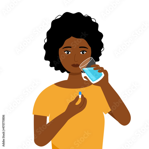 African woman taking medicine for illness treatment. Black female take vitamin or supplement capsule pill with water.