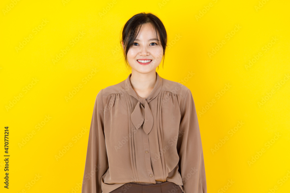 Pretty and healthy Asian woman smile and friendly laugh with innocent, charming face as happy and enjoy posing attractive costume fashion for beautiful blouse Pretty and healthy Asian woman smile and friendly laugh with innocent, charming face as happy and enjoy posing attractive costume fashion for beautiful blouse