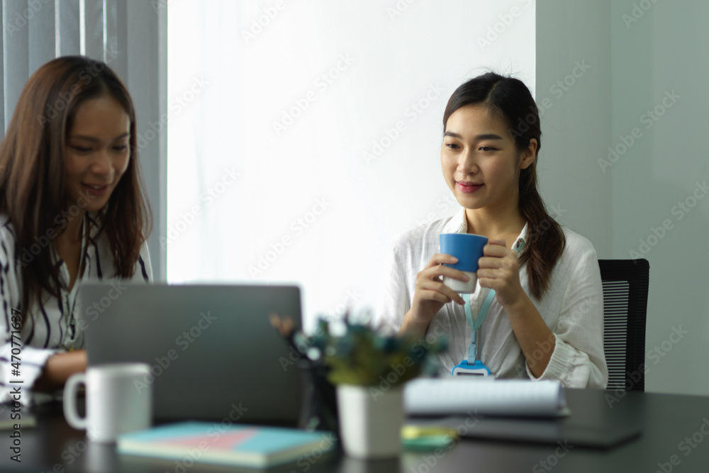 Young female entrepreneur satisfied with her assistant presentation Young female entrepreneur satisfied with her assistant presentation