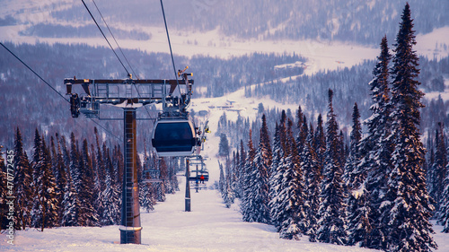 Принти на полотні Landscape mountain ski lift resort in winter forest sunset, aerial top view Keme