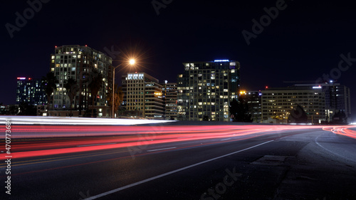San Jose Downtown and Car Light Trails on California State Route 87 during Rush Hour. San Jose, California, USA. © Yuval Helfman