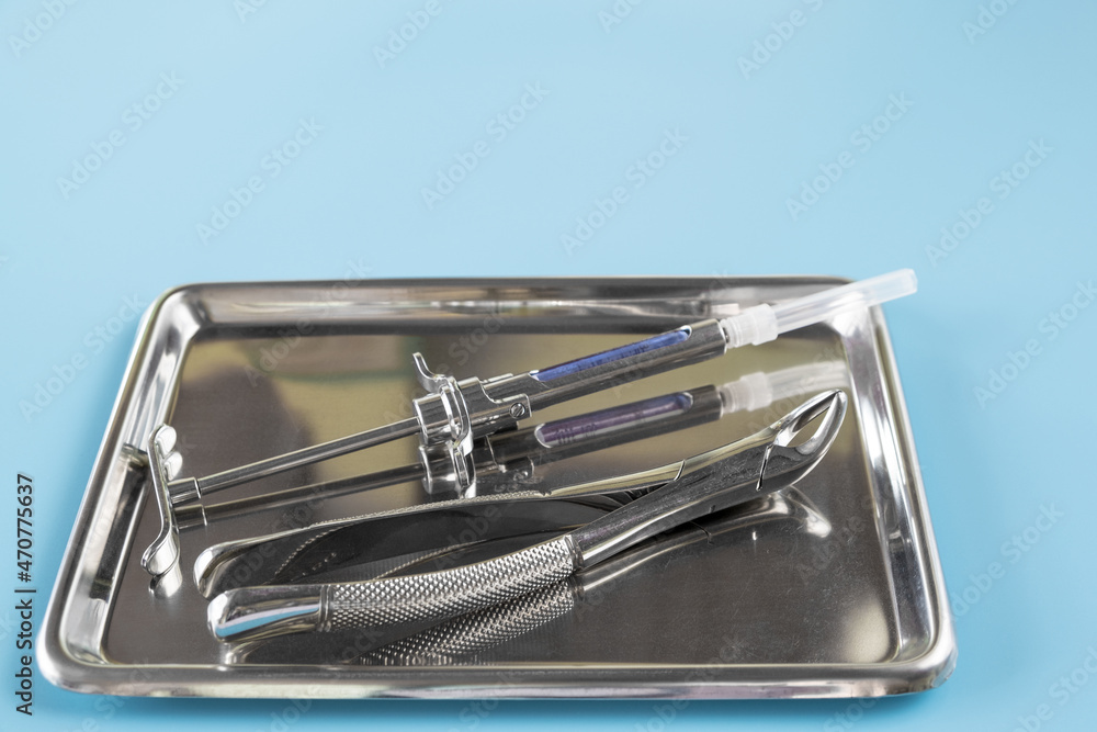 Dentistry medical tools forcept upper/ lower on blue background. Dentistry medical tools forcept upper/ lower on blue background.