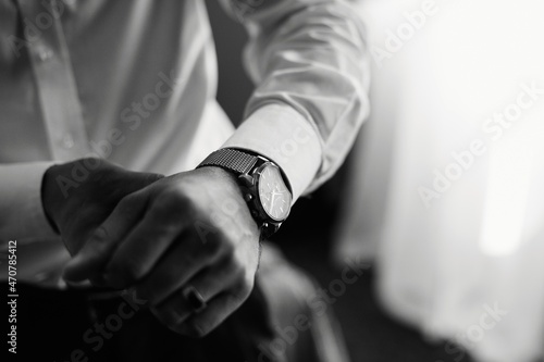 Man in white shirt wearing a wristwatch 