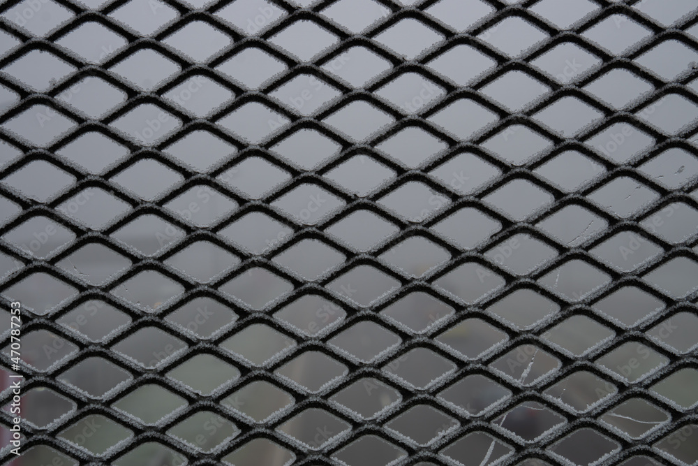 Iron sieve in the frost. Metal texture. Iron sieve in the frost. Metal texture.