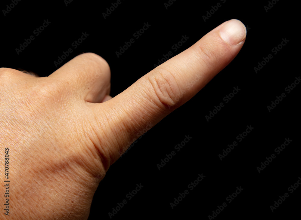 Fingers on a man's hand isolated on a black Fingers on a man's hand isolated on a black
