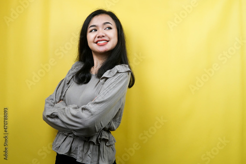 Beautiful young woman looking at empty space presenting something, promoting products, looking for ideas, advertising, isolated