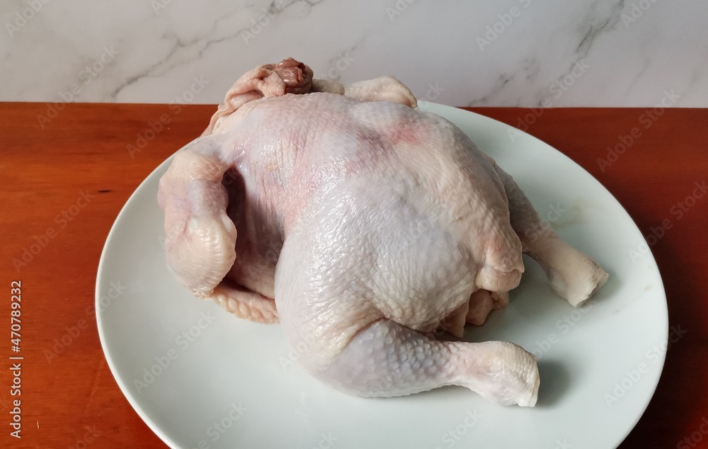 Preparing Raw Whole Chicken for Stuffing and Roasting Preparing Raw Whole Chicken for Stuffing and Roasting