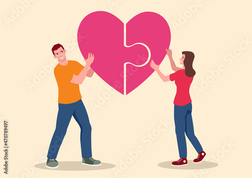 Young couple put together a puzzle that forms a heart symbol