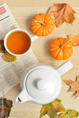 Tea pot, cup of hot beverag...