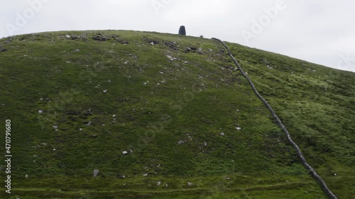 AERIAL - Eask Tower in Carhoo Hill, Dingle, County Kerry, Ireland, forward shot photo