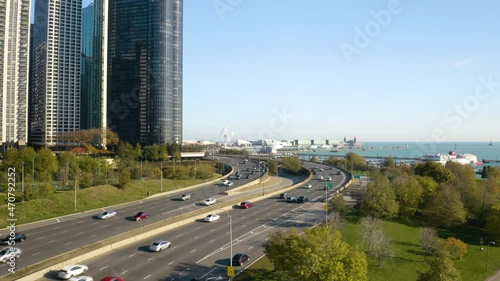 Cars Driving on Jean Baptiste Point DuSable Lake Shore Drive in Early Autumn. Chicago, Illinois photo