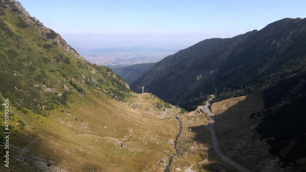 Drone shot flying over Transfagarasan road in the Carpathian Mountains, Romania